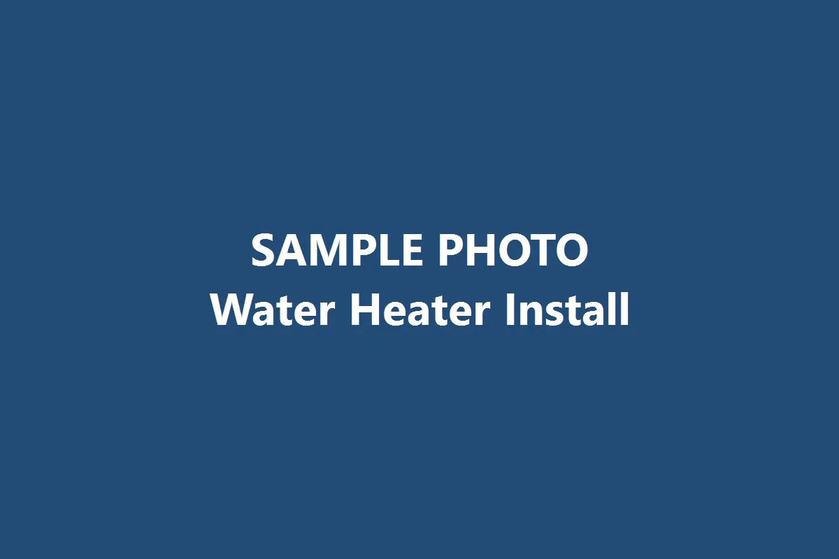 Technician installing a tankless water heater in a garage